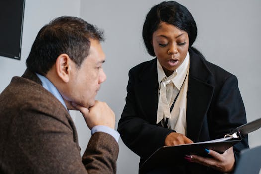 older woman confidently presenting at work