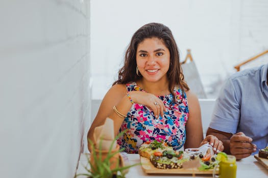 Woman enjoying a healthy meal with fruits and vegetables