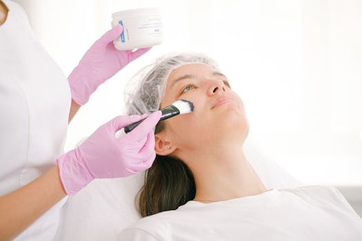 woman applying a facial mask