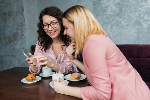 women laughing together over coffee