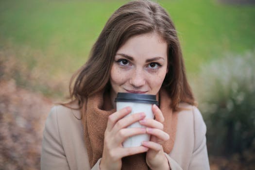 image of a woman enjoying her morning coffee while journaling