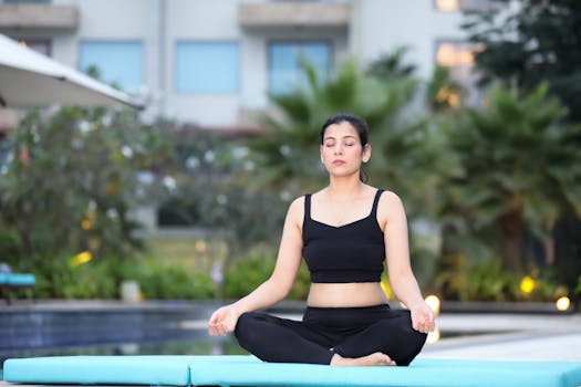 a woman practicing yoga outdoors